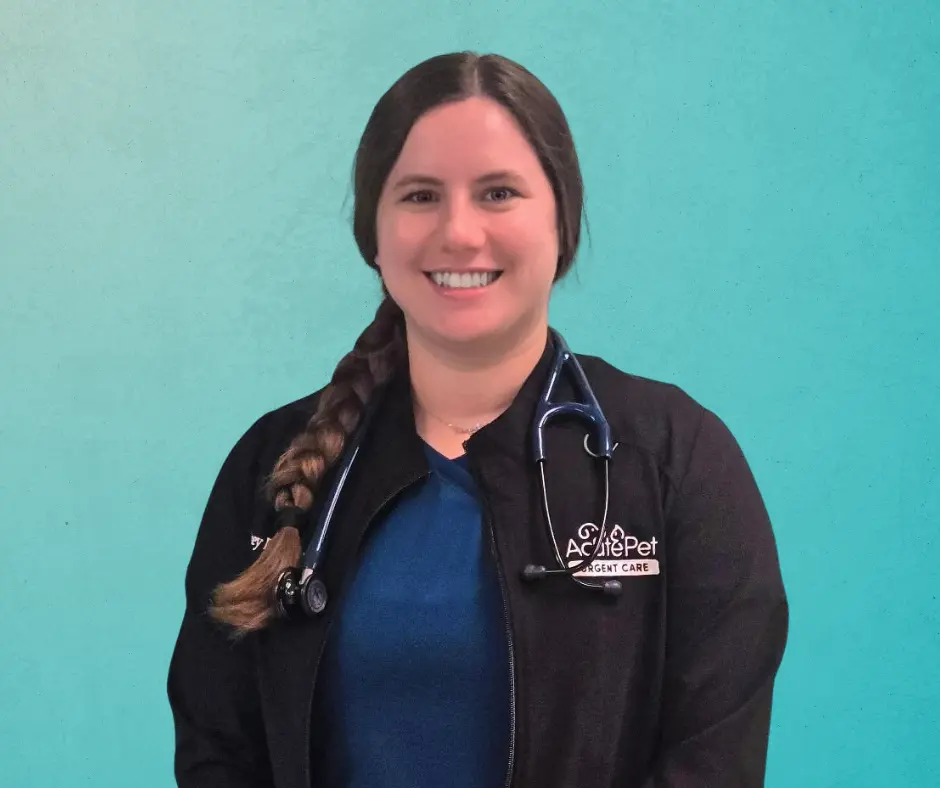 Dr. Audrey Emery smiling in front of a gradient teal background