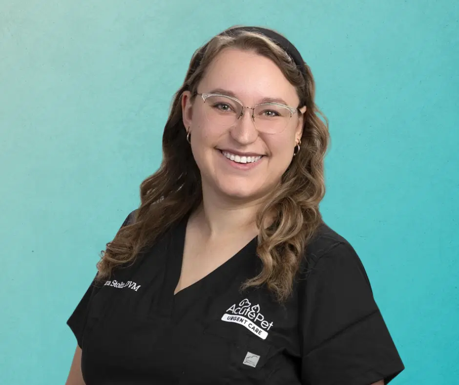 Sara Stoltz, DVM smiling in AcutePet scrubs on a gradient teal background